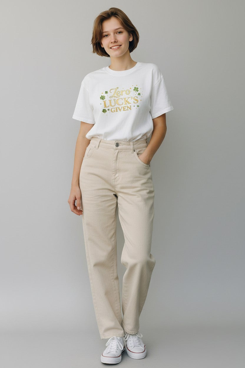 Woman wearing white “Zero Luck’s Given” shirt, a clean and bold graphic tee for casual outfits.