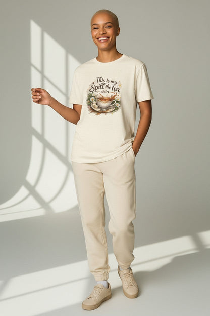 Woman wearing neutral beige “Spill the Tea” shirt, perfect for minimal aesthetic outfits and everyday comfort.