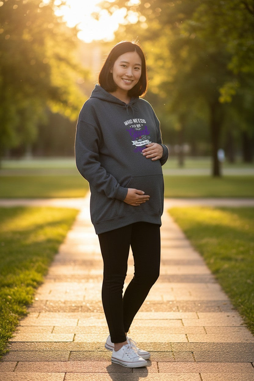 Woman wearing cozy graphic hoodie outdoors, perfect for fall outfits and relaxed casual style.