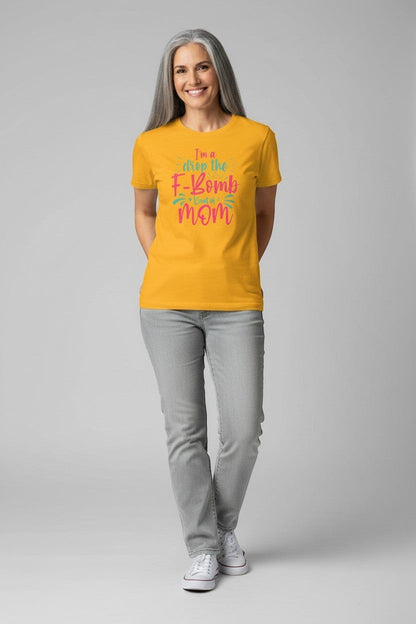 Woman wearing gold “Drop the F-Bomb Mom” t-shirt, a fun and energetic outfit.