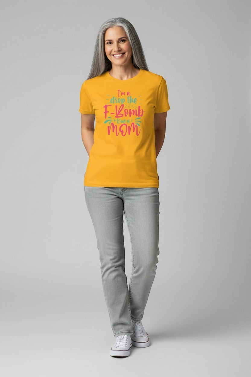 Woman wearing gold “Drop the F-Bomb Mom” t-shirt, a fun and energetic outfit.