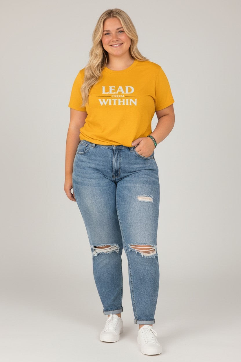 Woman wearing yellow “Lead From Within” t-shirt, a bright and uplifting casual look.