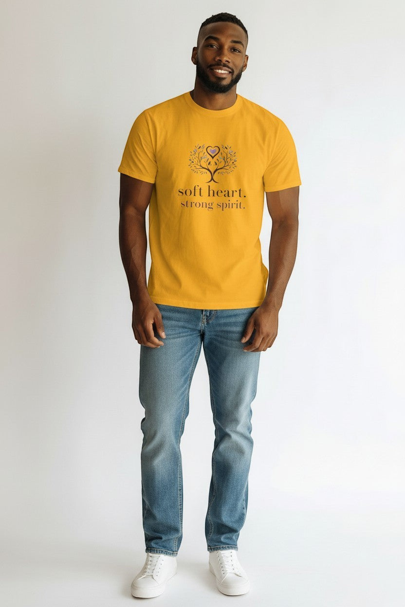 Man wearing yellow “Soft Heart Strong Spirit” t-shirt, a bold and inspiring casual outfit.
