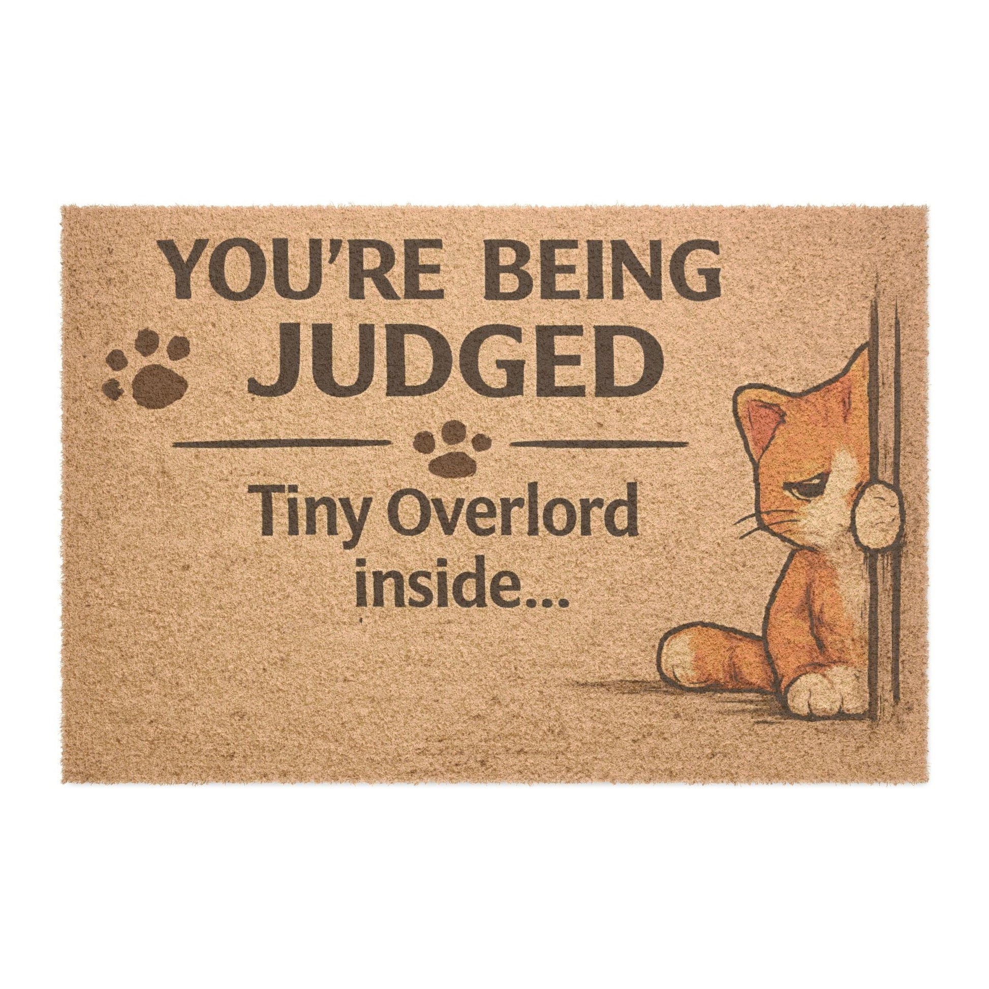 Clean product image of “You’re Being Judged – Tiny Overlord Inside” cat doormat, perfect for cat lovers and humorous home decor.