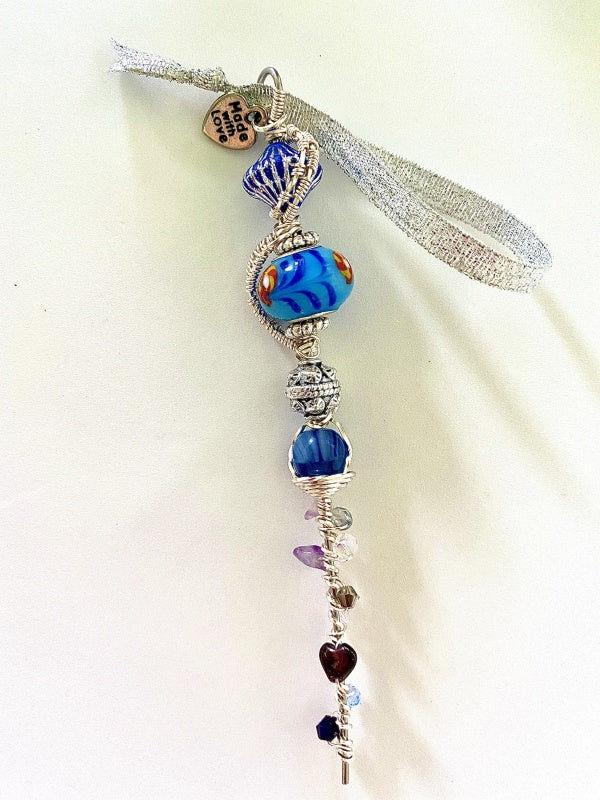 Blue & Silver Wire Wrapped Icicle with blue, purple, silver, and deep red beads wrapped in sliver wire with hanging ribbon and made with love charm