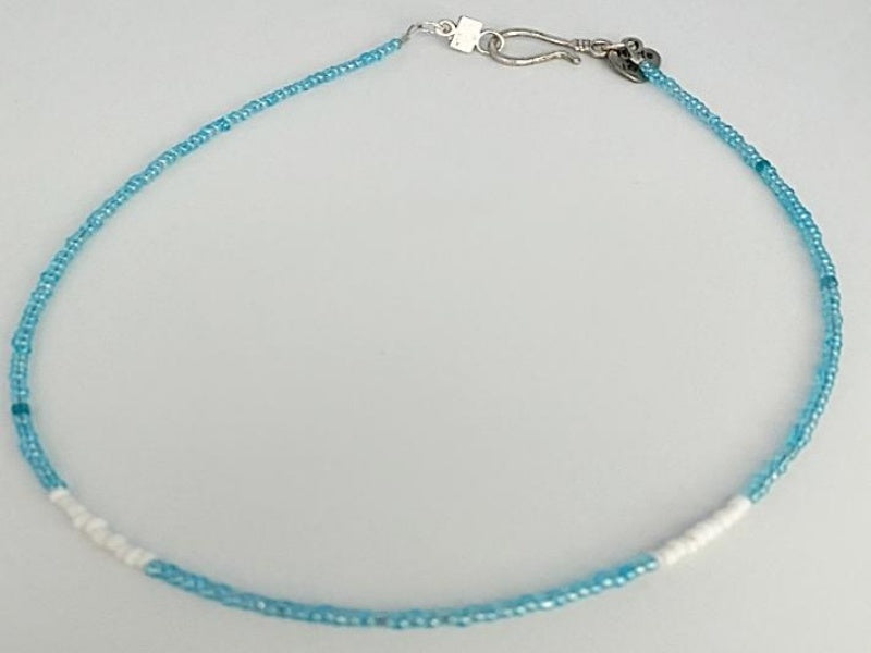 Blue and White Glass Seed Bead Necklace small blue and white glass seed beads with a base metal clasp and made with love charm