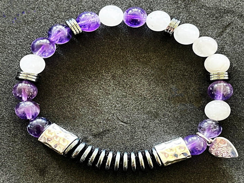 Say it with code 7" stretch bracelet made with amethyst, hematite, and Angola quartz beads with base metal spacers reads Focus in morse code
