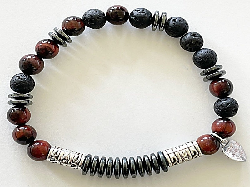  8" stretch bracelet made with lava stone, hematite, and tiger's eye with base metal spacers reads Focus in morse code