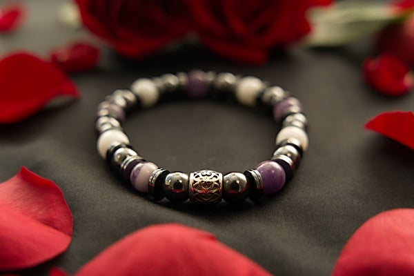 Beautiful stretch bracelet made with Dogtooth Amethyst, Hematite, and Snow Jade.