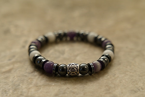 Beautiful stretch bracelet made with Dogtooth Amethyst, Hematite, and Snow Jade.