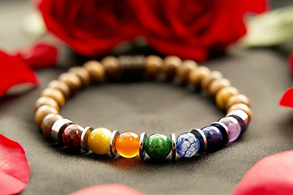 This special bracelet is made with fragrant black rosewood, red jade, lapis, and tiger eye for an effective chakra bracelet. It is worn by many for grounding, imparted growth, and protection.
