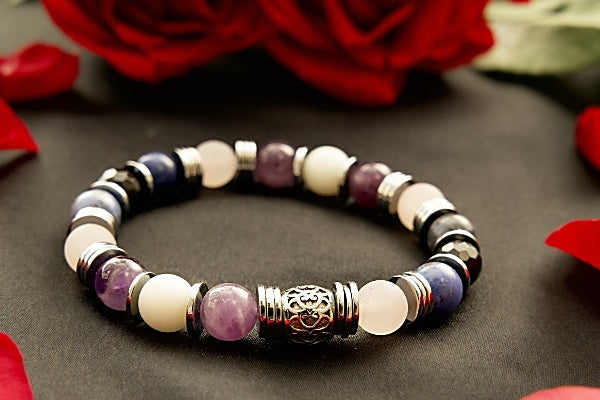 Bracelet with purple amethyst, white jade and blue sodalite beads on stretch cord with disk shaped base metal spacers