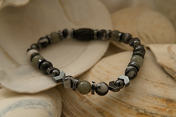 This Stretch Bracelet made with Labradorite, Zebra Jasper, and Hematite is said to be able to help one achieve success, maintain balance, and help them to face the stress of everyday life in a more positive light.