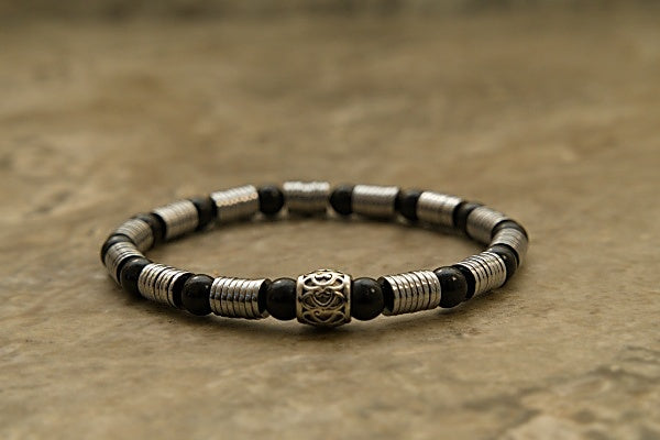 Black Onyx and Hematite Heishi Stretch Bracelet with Hematite disk and Black Onyx round beads.