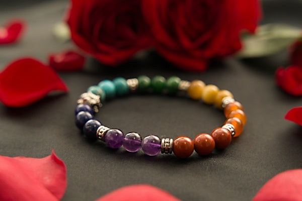 Chakra Stretch Bracelet made with Red Ruby beads. Contains all the colors of the Chakra Red, Orange Yellow, Green, Blue, Indigo, & Violet